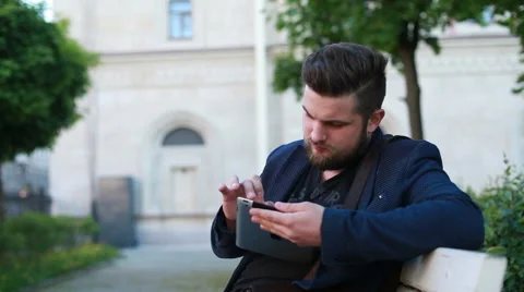 Portrait of a handsome young man working with a tablet Stock Footage 50982111