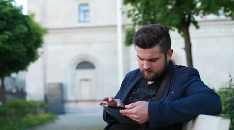 Portrait of a handsome young man working with a tablet Stock Footage 50982113