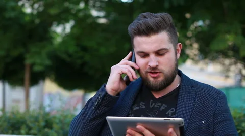 Portrait of a handsome young man working with a tablet Stock Footage 50982123