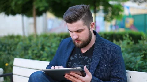 Portrait of a handsome young man working with a tablet Stock Footage 50982125