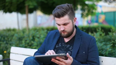 Portrait of a handsome young man working with a tablet Stock Footage 50982132