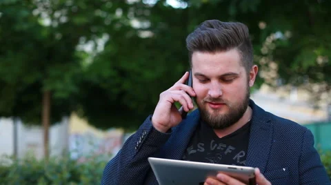 Portrait of a handsome young man working with a tablet Stock Footage 50982231