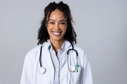 Portrait of happy african american mid adult female doctor with stethoscope Stock Photos