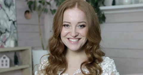 Portrait of a happy bride in a white wedding dress smiling. Stock Footage 166889403