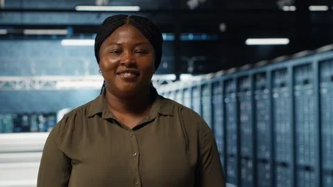 Portrait of happy data center engineer conducting security audits Stock Photos
