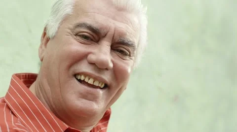 Portrait of happy elderly man with white hair smiling Stock Footage 11444403