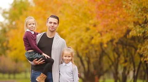 Portrait of happy family in autumn park Stock Footage
