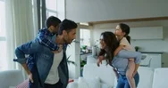 Portrait Of Happy Family Having Fun  In Slow Motion On Kitchen. Stock Footage
