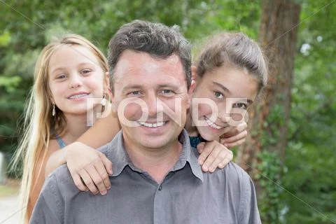 Portrait of happy father and his sweet daughter at park Stock Photos