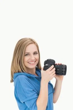 Portrait of happy female photographer with photographic camera Stock Photos