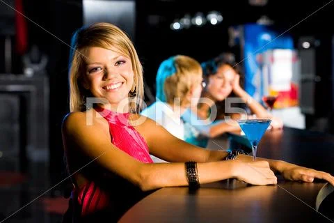 Portrait of happy girl looking at camera in the bar Stock Photos