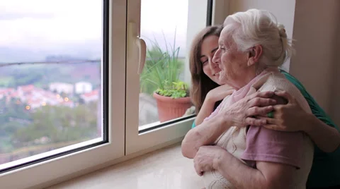 Portrait of happy grandmother with granddoughter hugging Stock Footage