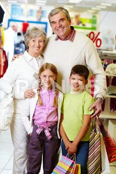 Portrait of happy grandparents and grandchildren during shopping Stock Photos