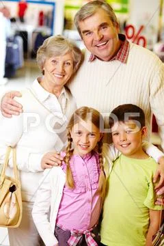 Portrait of happy grandparents and grandchildren during shopping Stock Photos