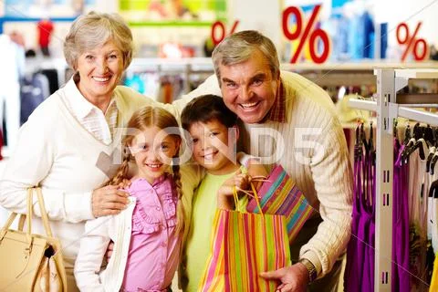 Portrait of happy grandparents and grandchildren during shopping Stock Photos