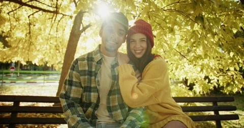Portrait of a happy guy in a hat and a plaid shirt who is sitting with his Stock Footage 299924103
