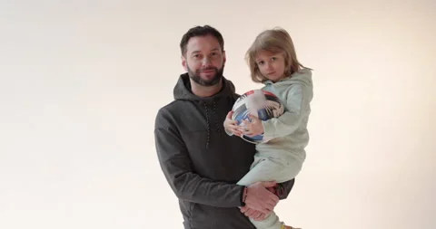 Portrait of a happy handsome dad with his son in his arms. Stock Footage 253397809