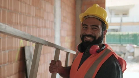 Portrait Of Happy Hispanic Worker Smiling In Construction Site Stock Footage