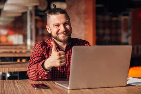 Portrait of happy it developer showing finger up Stock Photos