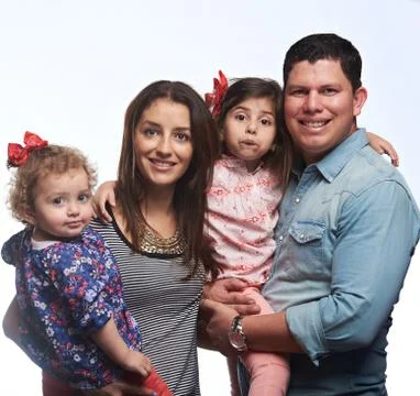 Portrait of happy latino family Stock Photos