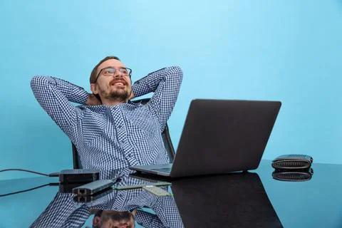 Portrait of happy looking man, computer support specialist, programmer sitting 스톡 사진