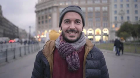 Portrait of a happy man looking at camera with smiling face. Cheerful people in Stock Footage 168946895