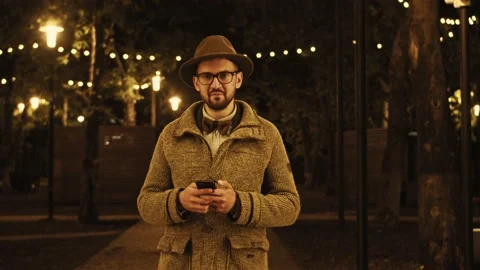 Portrait of happy man reading sms on mobile phone outdoors. Closeup surprised Stock Footage 155689655