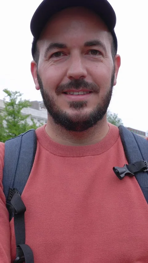 Portrait of happy man smiling at camera standing in Amsterdam Stock Footage 276739058
