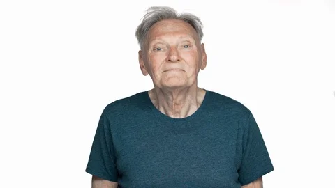 Portrait of happy old aged man 70s having gray hair in basic t-shirt looking at 스톡 동영상 89663202