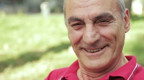 Portrait of happy old man looking at camera Stock Footage 32356344