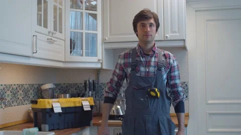 Portrait of happy plumber in the kitchen Stock Footage 131211405