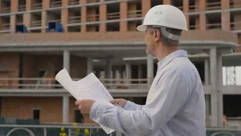 Portrait of Happy professional construction engineer man holding the blueprint Stock Footage 111768406