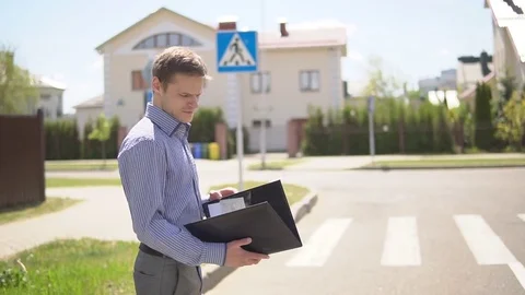 Portrait of happy real state agent holding file folder Stock Footage 76635389