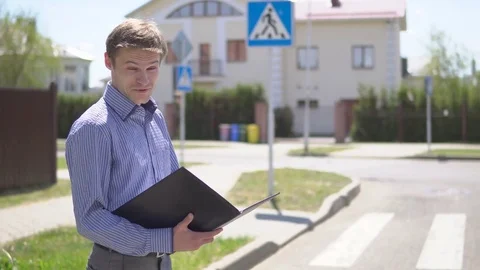Portrait of happy real state agent holding file folder Stock Footage 76636657
