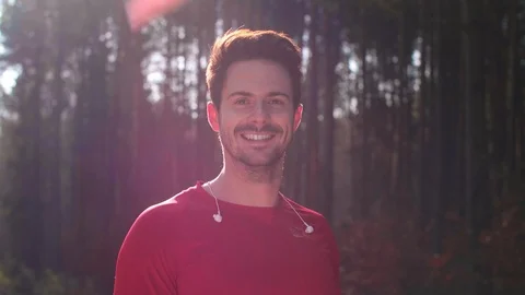 Portrait of happy runner in the forest Stock Footage 102826403