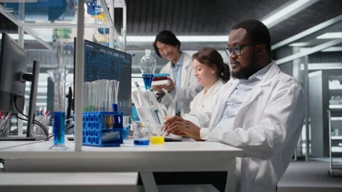 Portrait of happy scientist using computer program for DNA data analysis Stock Footage 320726842