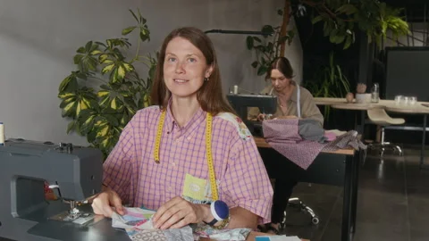 Portrait of Happy Seamstress Working on Patchwork Design in Workshop 動画素材 315735619