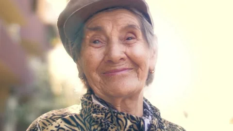 Portrait of happy smiling 92 year old senior woman outside. Closeup Stock Footage