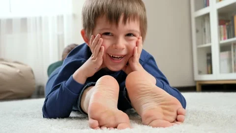 Portrait of happy smiling boy lying on m... | Stock Video | Pond5