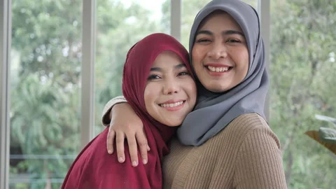 Portrait of happy, smiling two muslim wo... | Stock Video | Pond5