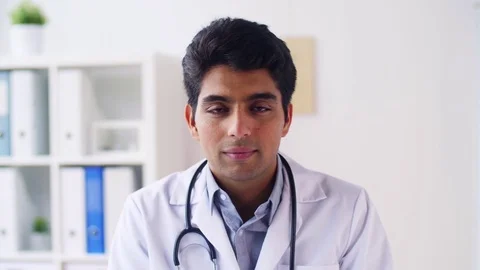 Portrait of happy smiling young indian male doctor Stock Footage