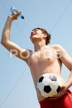 Portrait of happy sportsman refreshing after game Stock Photos