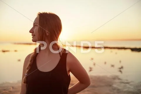 Portrait of happy teen girl on beach Stock Photos