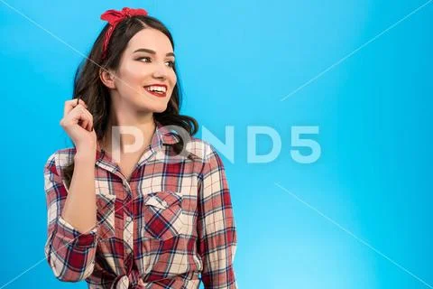 The portrait of the happy woman on the blue background Stock Photos