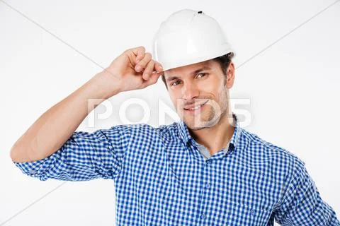 Portrait of happy young man architect in building helmet Stock Photos