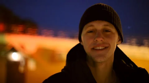 Portrait of happy young man in a black hat and black jacket Stock Footage 59736499