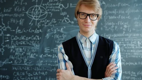 Portrait of happy young man student standing in class smiling looking at camera Stock Footage 124881409