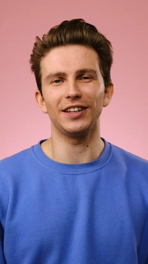 Portrait of a Happy Young Man Talking to the Camera Stock Footage 328127500
