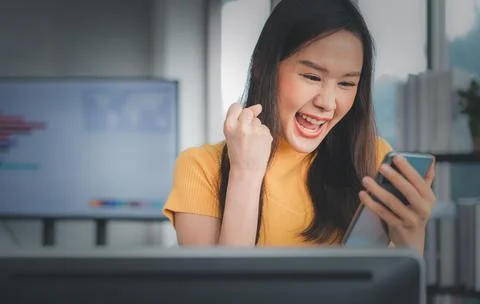 Portrait happy young programmer Asian woman work at start up technology offic Stock Photos