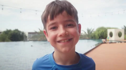 Portrait Happy Young Smiling Boy Portrait by Swimming Pool. 스톡 동영상 348024122